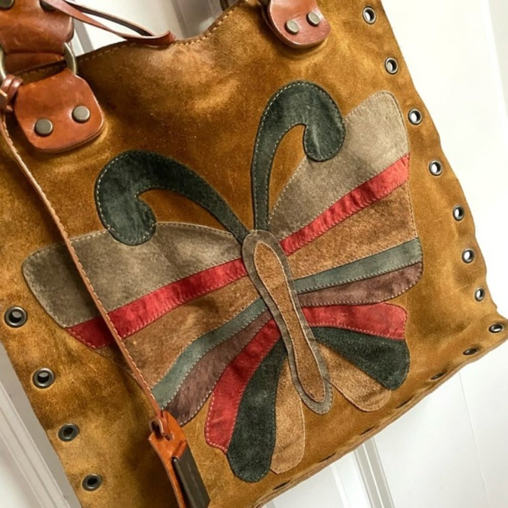 $999 ISO Dolce and Gabbana suede shoulder bag with large butterfly on the front.